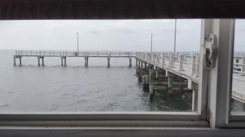 Long Pier Shot Through Window 動画素材 158842004