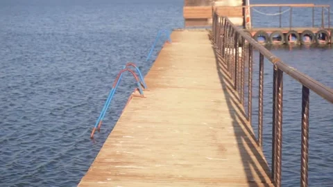 Long pier on the water Stock Footage 318452335
