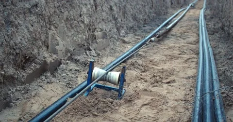 Long pipeline, machine is dragging a pipe on the ground, work, 4k Stock Footage 158689752