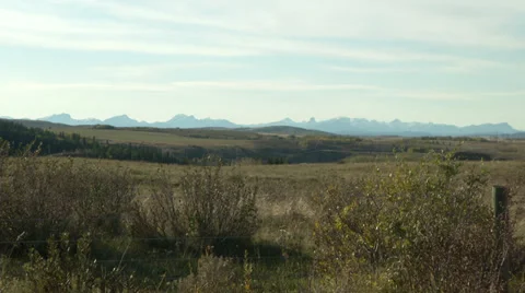Long prairie distant mountain shot Stock Footage 31155619