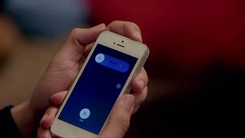 Long-pressing the button to turn off the smartphone Stock Footage 261642093