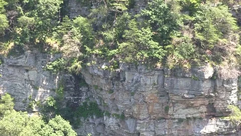 Long pull from cliffside to valley Stock Footage 91947174