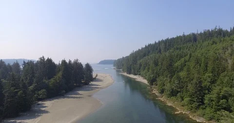 Long push down river towards ocean Stock Footage 86296881