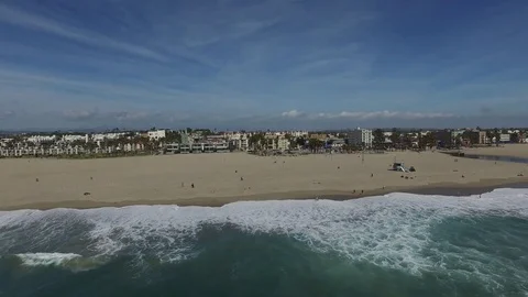 Long push Over water on to beach and vollyball courts Video stock 76139650