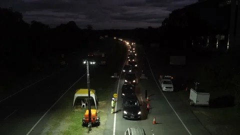 Long Queue Of Cars Waiting To Cross The Gold Coast Border - Traffic At Stock Footage 138903912
