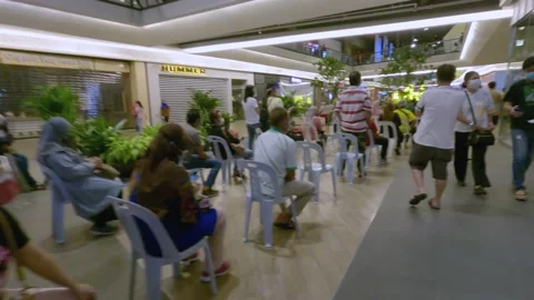 Long Queue for Coronavirus Vaccination Stock Footage 157808627