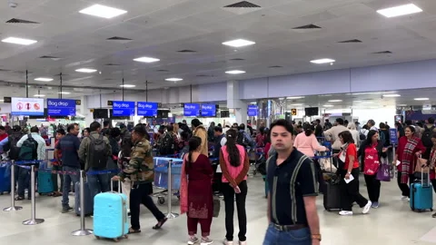 Long queue at IndiGo Check-In counter at Delhi Airport Stock Footage 325769102