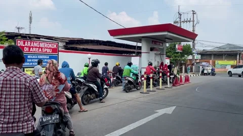 Long queue of motorbike riders at the gas station Stock Footage 280897853
