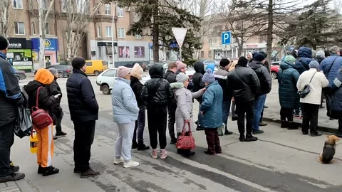 Long queue of people to supermarket in o... | Stock Video | Pond5