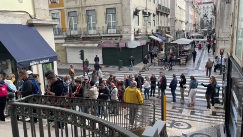 Long queue of people waiting to get into Santa Justa Lift, Lisbon Stock Footage 195668291