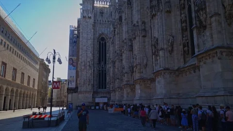 Long queue for tourist waiting to visit milan duomo cathedral in downtown Stock Footage 247675437