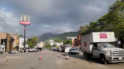 Long queue of vehicles, traffic cones and utility truck indicates active Stock Footage 341994825