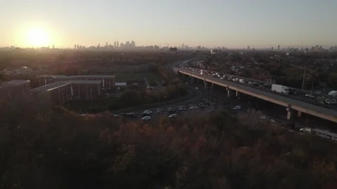Long queue of vehicles on way out of city at dusk Stock Footage 167911075