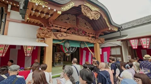 Long Queue of Visitors at Carved Shrine Gate, Tokyo Temple Festival Stock Footage 343850216