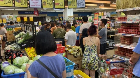 Long Queue Waiting to Checkout at Supermarket During Food Run Stock Footage 126427637