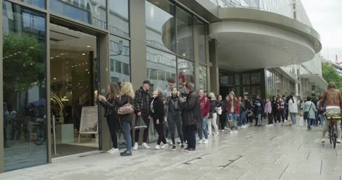 Long Queue of Young People Waiting to Enter Store in Zeil Frankfurt Stock Footage 132169501
