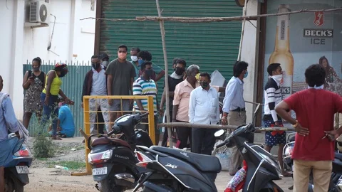 Long queues infront of liquor shops Stock Footage 129773087