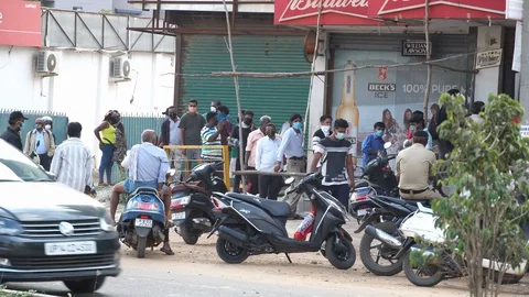 Long queues infront of liquor shops Stock Footage 129773294