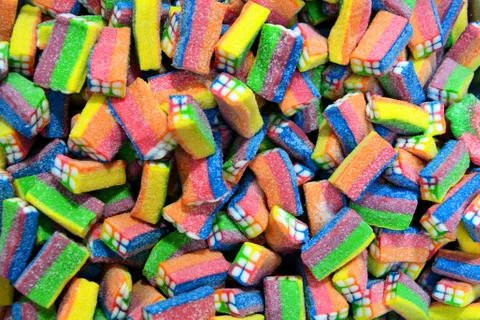 Long rainbow shape bright sugar marmalade candy flavor fruit, colorful jelly Stock Photos