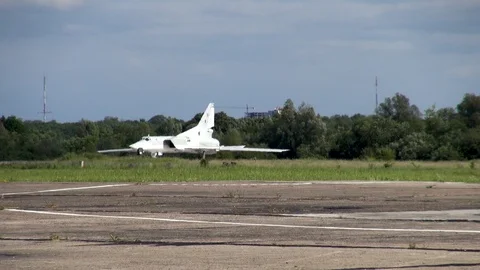 Long-range supersonic bomber Tu-22M3  turns at start of runway for take-off. Stock Footage 122817305