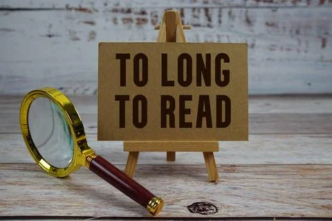 To Long To Read text written on paper with magnifying glass Stock Photos