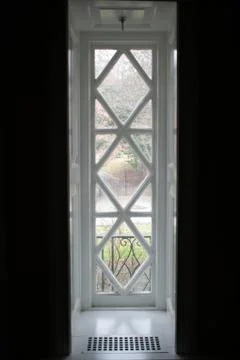 A Long Rectangular Window With a Diamond Pattern Stock Photos