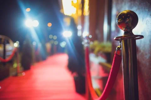 Long red carpet between rope barriers on entrance. Stock Photos
