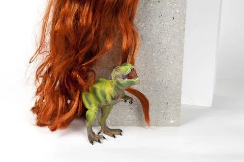 Long red wig cinder block and trex Stock Photos