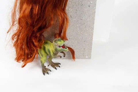 Long red wig cinder block and trex Stock Photos