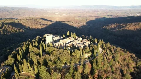Long Reverse aerial drone view Gargonza Castle Tuscany Italy sunset Stock-Footage 168540933