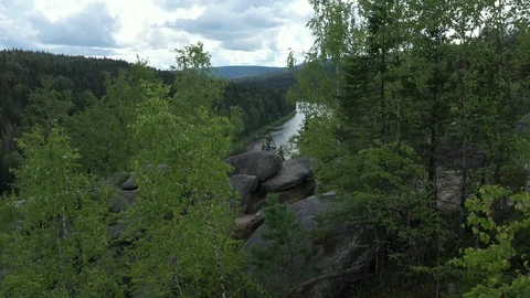 Long river that flows between two banks with trees Stock Footage 120242762