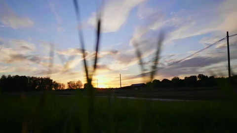 Long road and trees view during sunset. Beautiful sky and cloud Stock-Footage 179813326