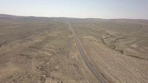 Long road in empty desert Stock Footage 166363372