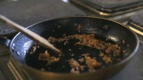 Long roasted chopped bacon in a frying pan Video stock 77480895