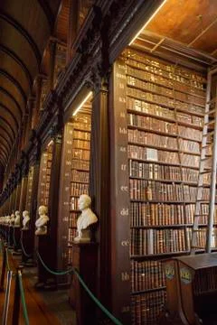 The Long Room interior Of The Old Library At Trinity College. Marble busts of Stock Photos