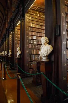 The Long Room interior Of The Old Library At Trinity College. Marble busts of Stock Photos