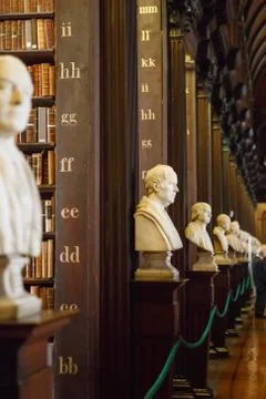 The Long Room interior Of The Old Library At Trinity College. Marble busts of Stock Photos