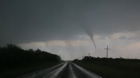 Long rope tornado passes by in Kansas Stock Footage