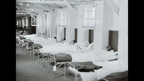 Long Row Of Beds In A Hospital With Bed Resting Female Patients Stock Footage 99355894