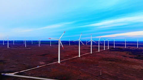 Long row of wind turbines at twilight in rural area Video stock 333837857