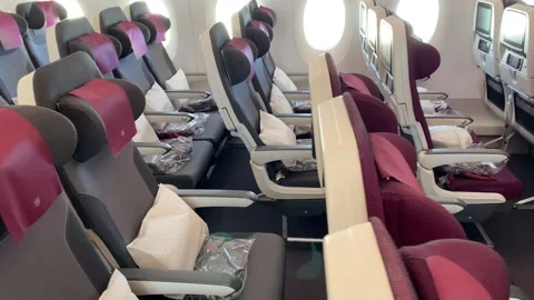 Long rows of empty red seats with black armrests close view Stock Footage 145571857