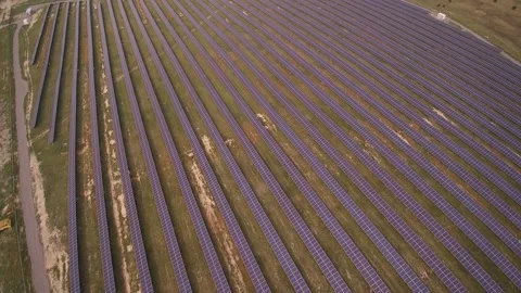 Long rows of solarcells generate renewable energy at station Stock Footage 169855939