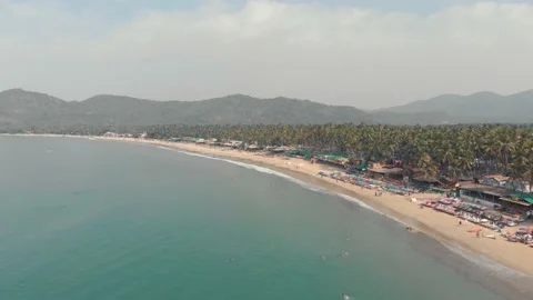 Long sand stretch of Palolem beach. Tranquil turquoise sea waters. Goa, Stock Footage 144836668