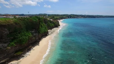 Long sandy beach and azure ocean of Bali island Stock Footage 108676844