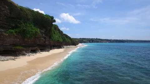 Long sandy beach and azure ocean of Bali island Stock Footage 108677008