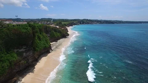 Long sandy beach and azure ocean of Bali island Stock Footage 108677414