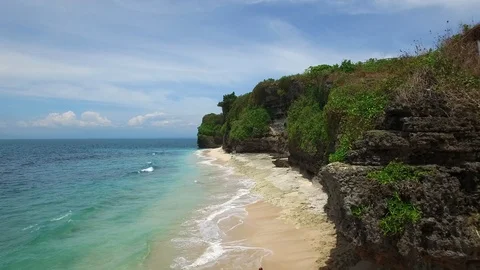 Long sandy beach and azure ocean of Bali island Stock Footage 108680012