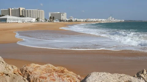 Long sandy beach in Vilamoura, Loule, Algarve, Portugal on a sunny day Stock Footage 103289857