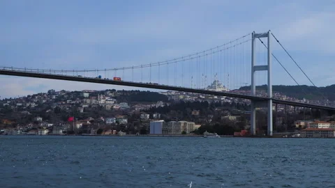 Long scenic panorama of cable-stayed bridge with cars moving across Bosphorus Stock Footage 258945515