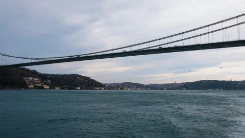 Long scenic panorama of cable-stayed bridge with cars moving across Bosphorus Video stock 258946155